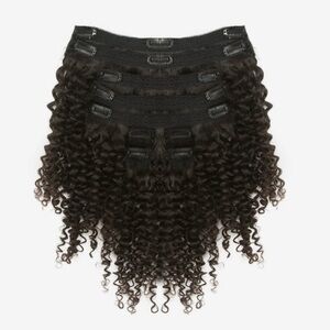 24" Brazilian curly clip-ins, 100% virgin hair, 200g. Soft and natural-looking.